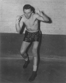 A boxer shown in boxing trunks and boots